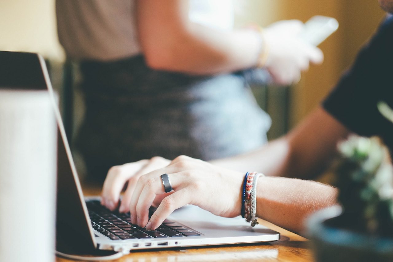 Woman typing on laptop