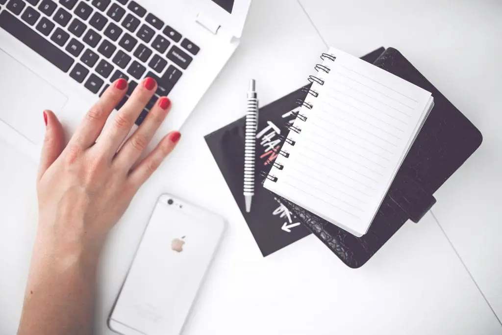 laptop and notepad on desk