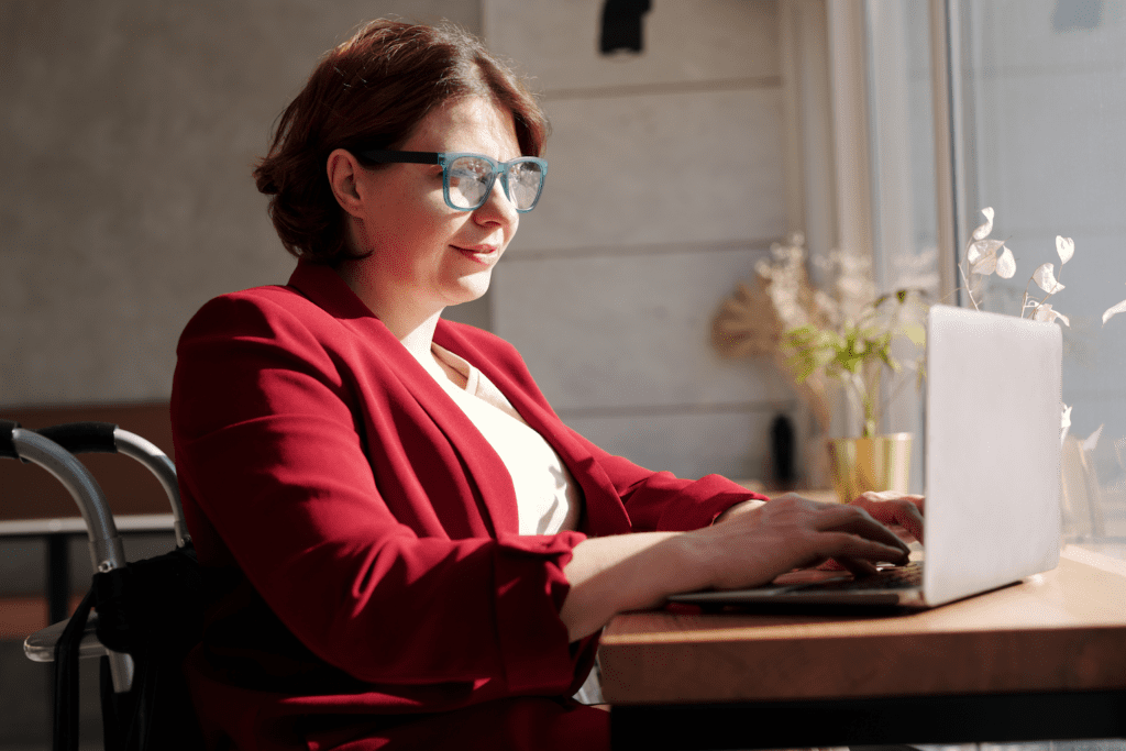 Woman working on laptop at a cafe