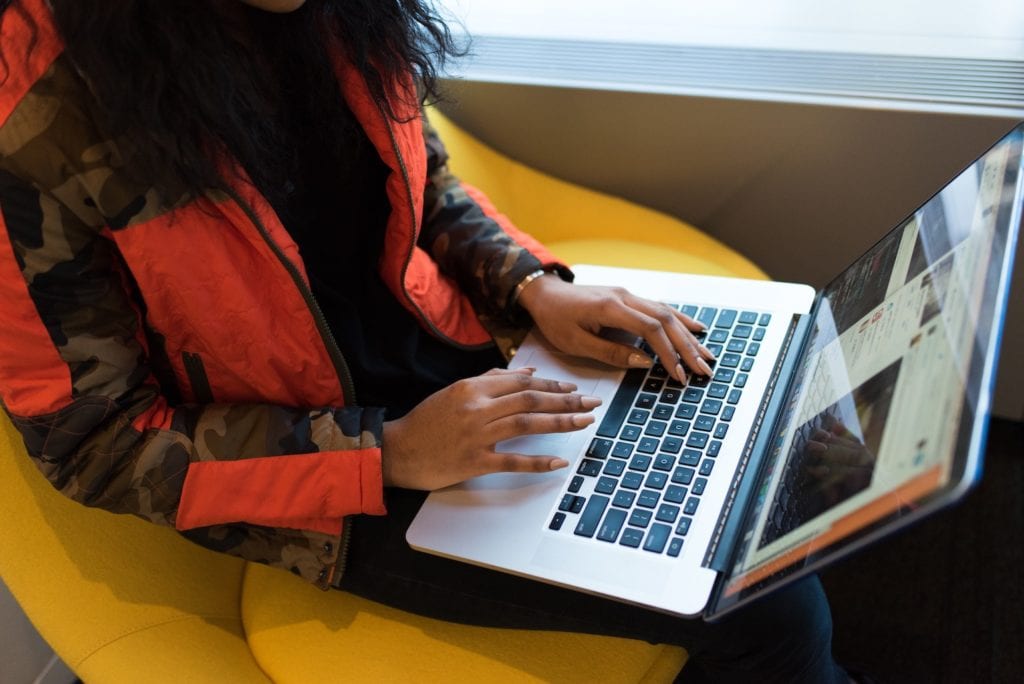 woman on laptop using docker