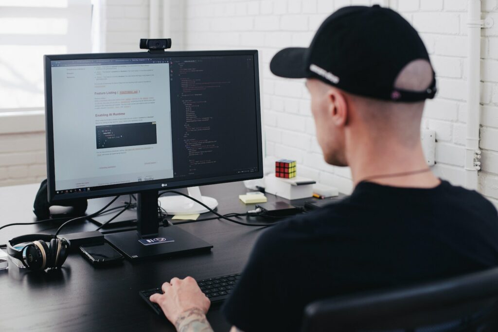 Man typing code on the computer