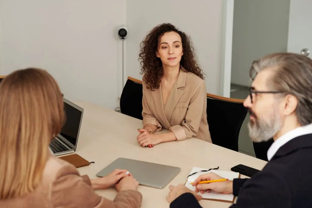 woman listening to interviewer