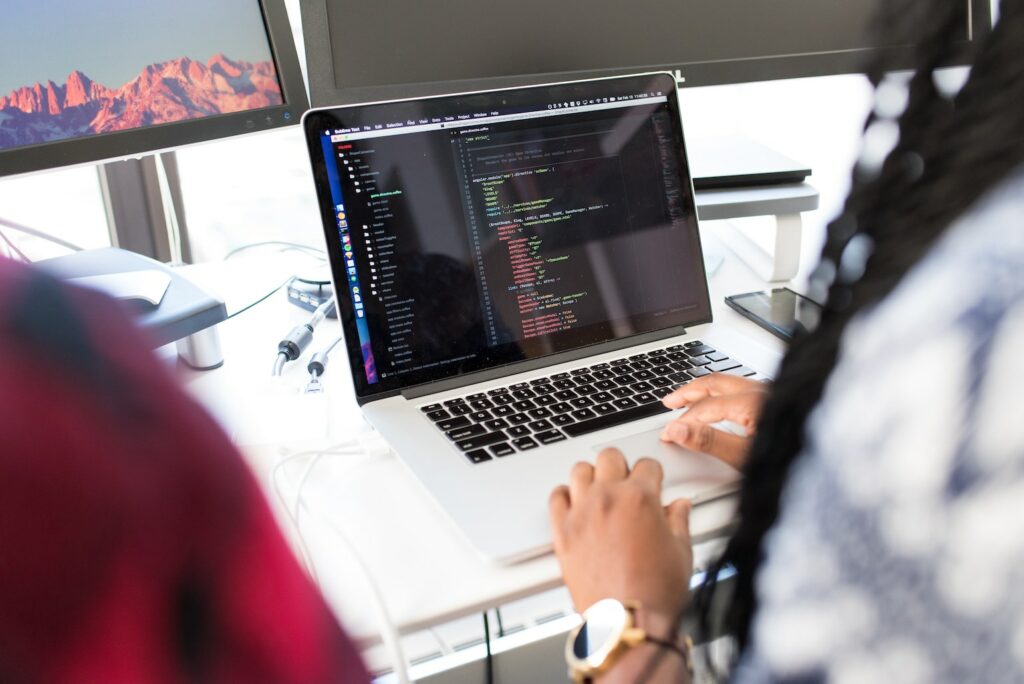 Software engineer coding on a laptop