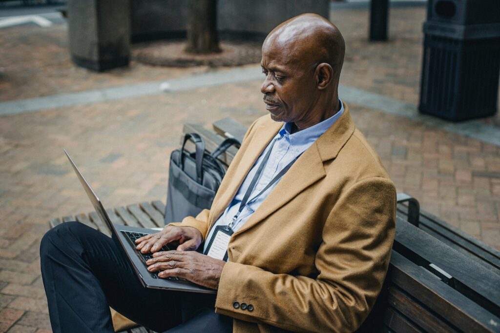 older man on a laptop