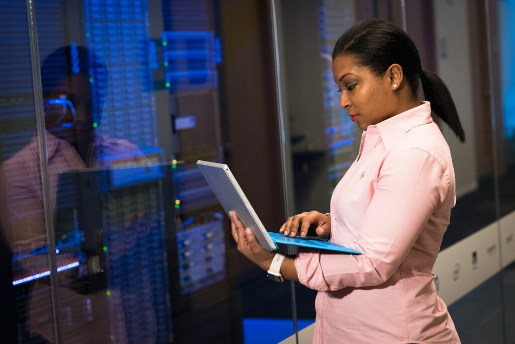 System administrator looking at laptop