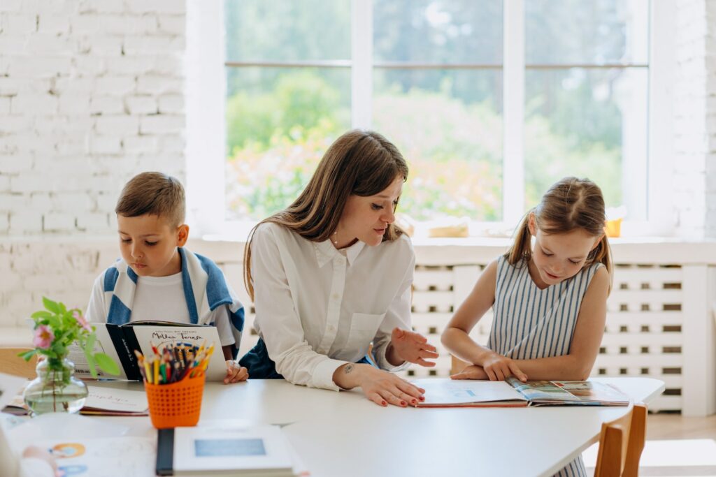 Female teacher helping students